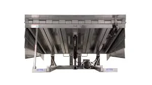 Steel pit dock leveler platform in tilted position with an internal cylinder and loading dock leveler hydraulic pump.