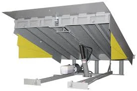 Under-deck structural frame view of a hydraulic loading dock leveler and its integrated hydraulic cylinder and pump.